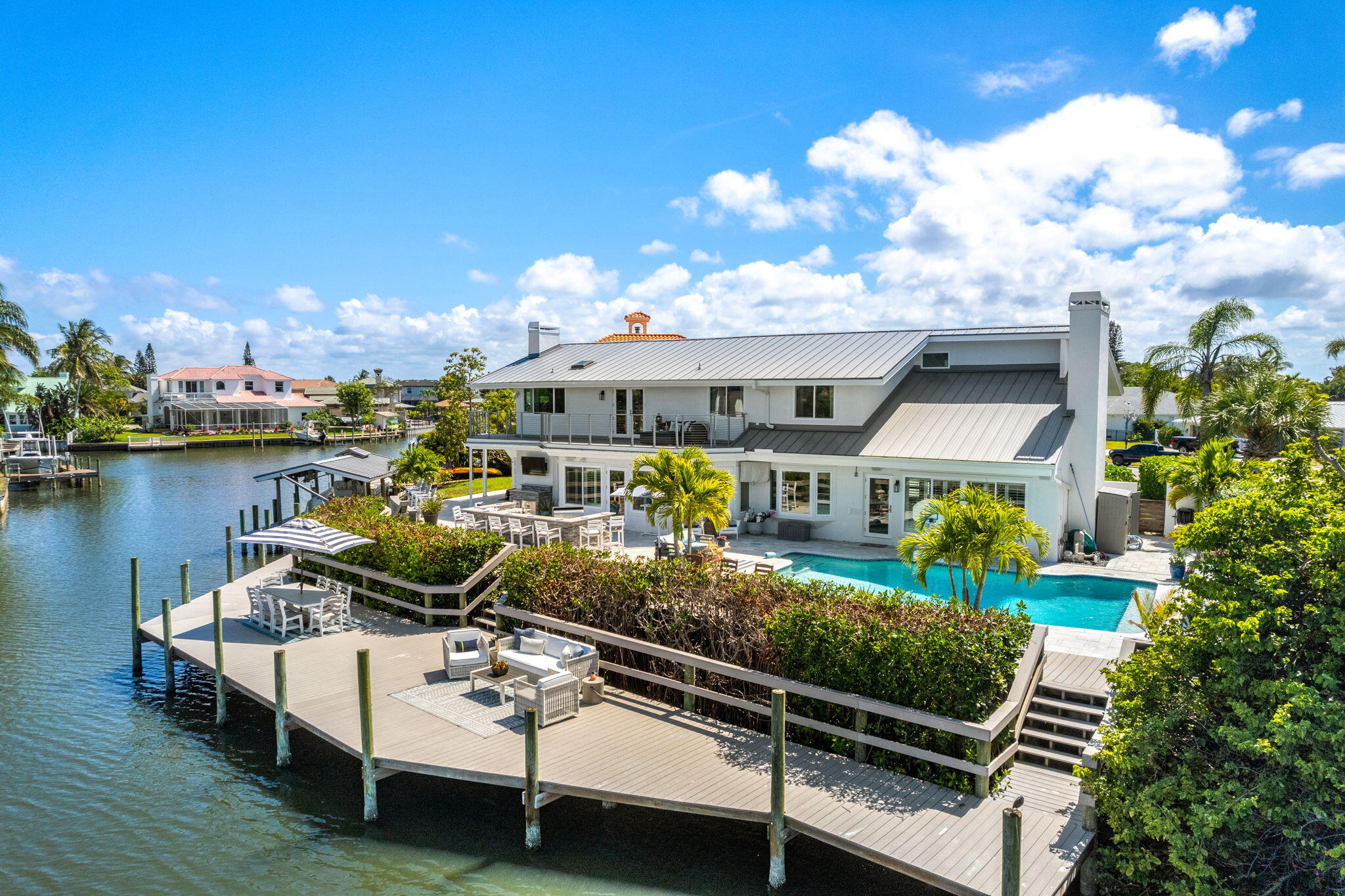452 Sandy Key Melbourne Beach, FL 32951 - Photo 127 of 140 a view of a house with swimming pool and sitting area