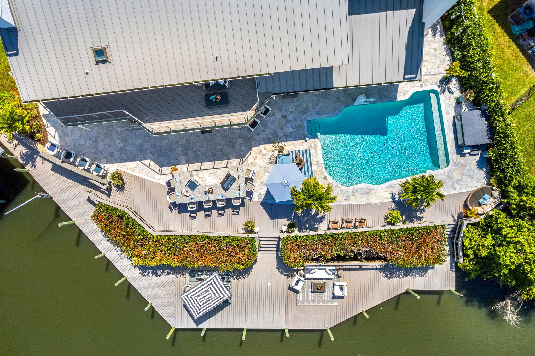 452 Sandy Key Melbourne Beach, FL 32951 - Photo 137 of 140 an aerial view of a house with swimming pool and outdoor seating