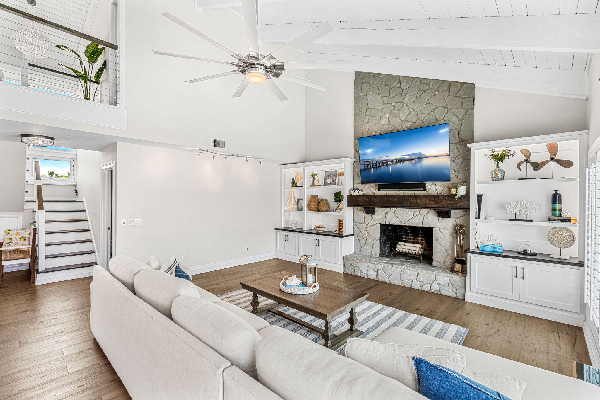 452 Sandy Key Melbourne Beach, FL 32951 - Photo 15 of 140 a living room with furniture and a fireplace