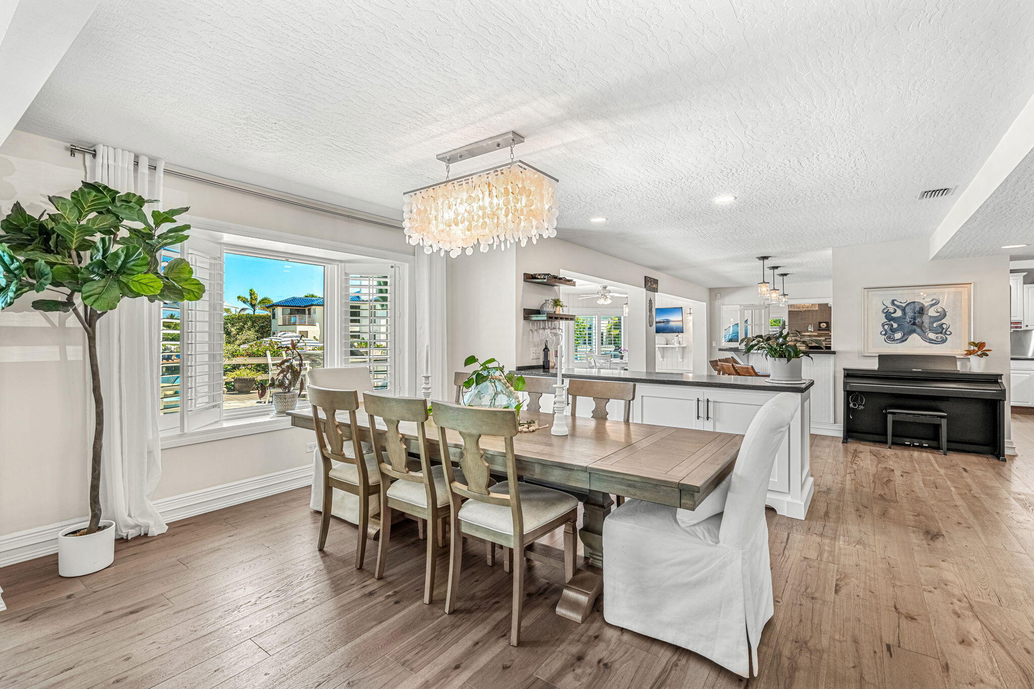 452 Sandy Key Melbourne Beach, FL 32951 - Photo 22 of 140 a view of a dining room with furniture and window