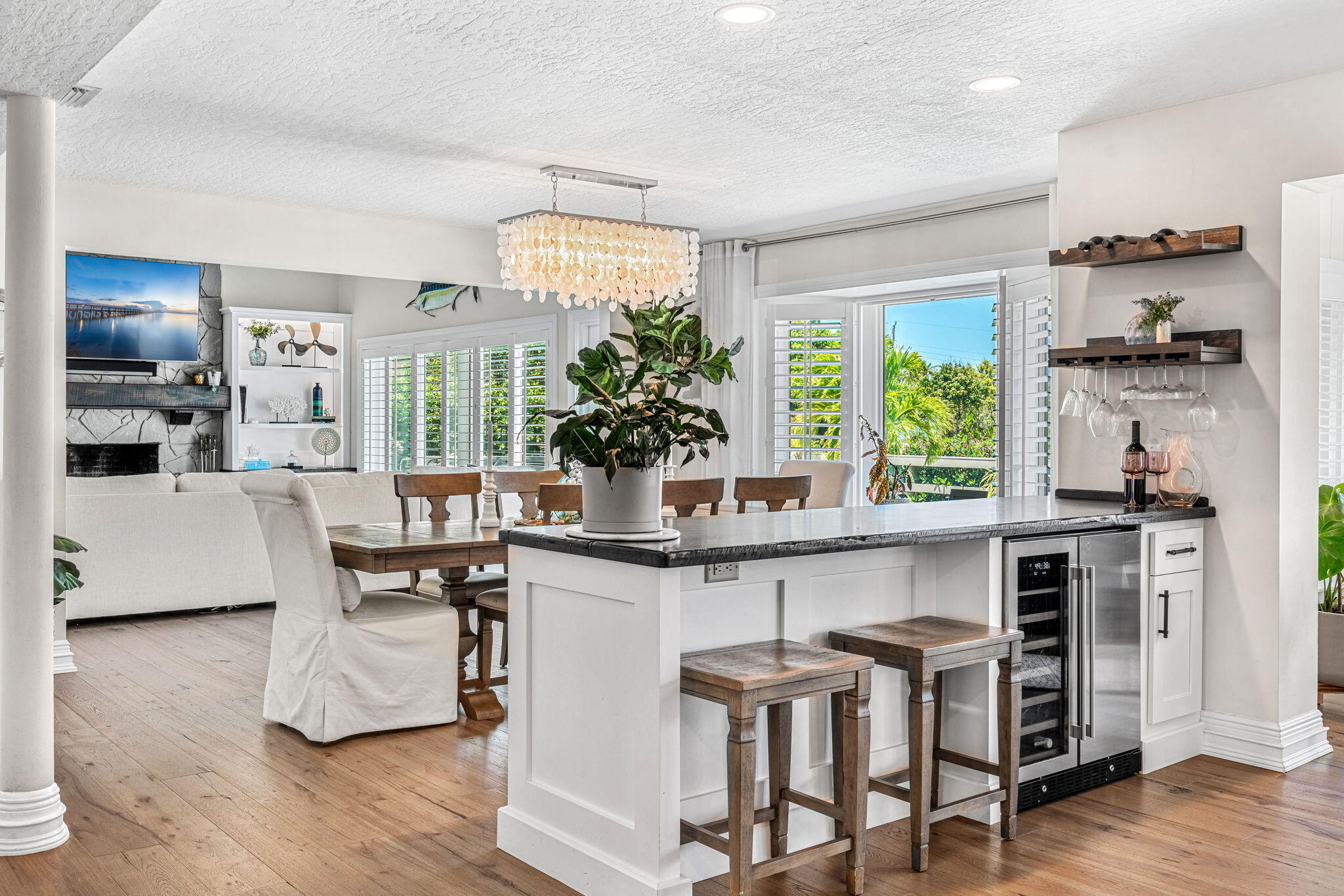 452 Sandy Key Melbourne Beach, FL 32951 - Photo 24 of 140 a kitchen with stainless steel appliances a table and chairs in it