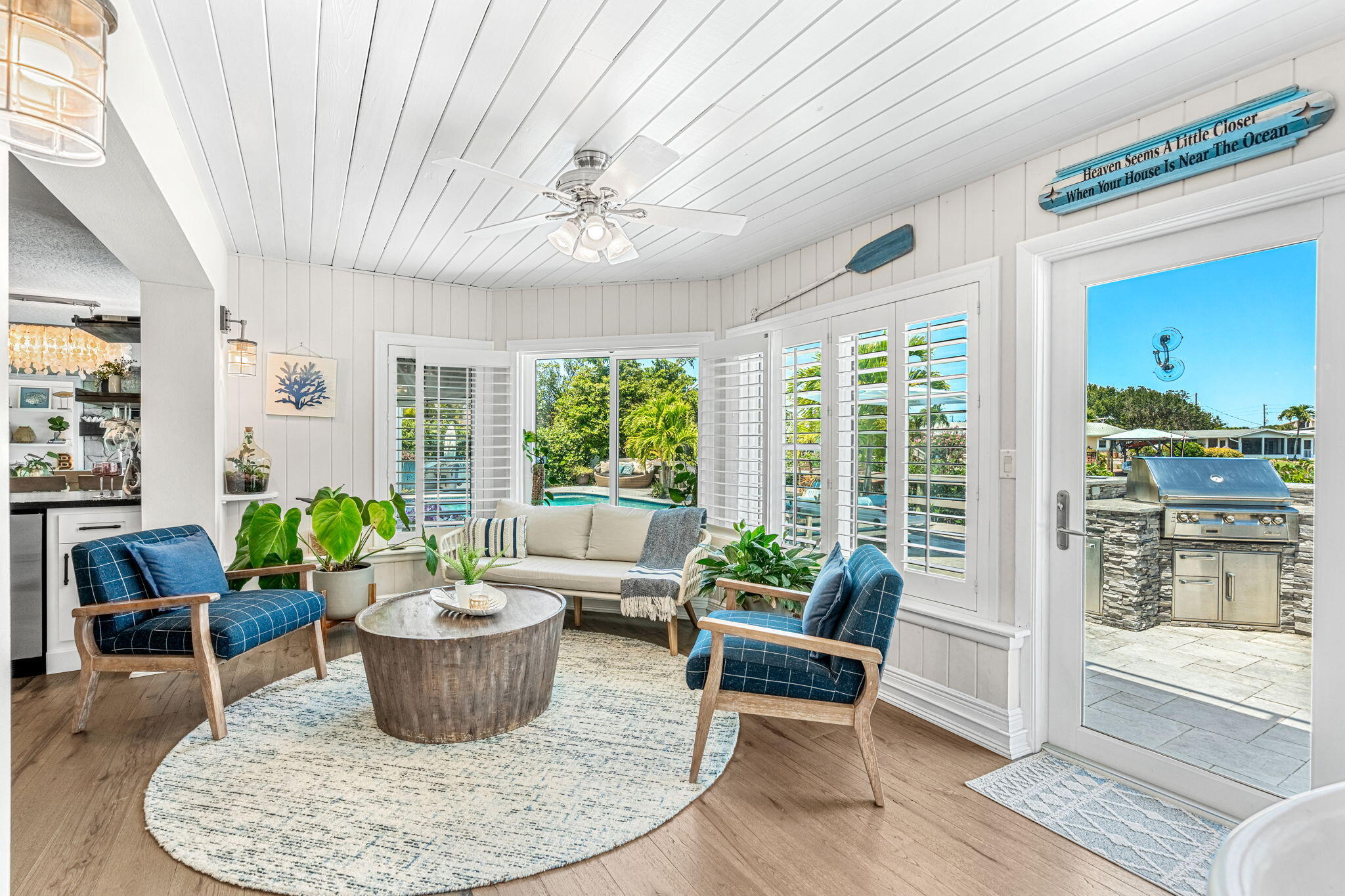 452 Sandy Key Melbourne Beach, FL 32951 - Photo 32 of 140 a living room with furniture and a potted plant