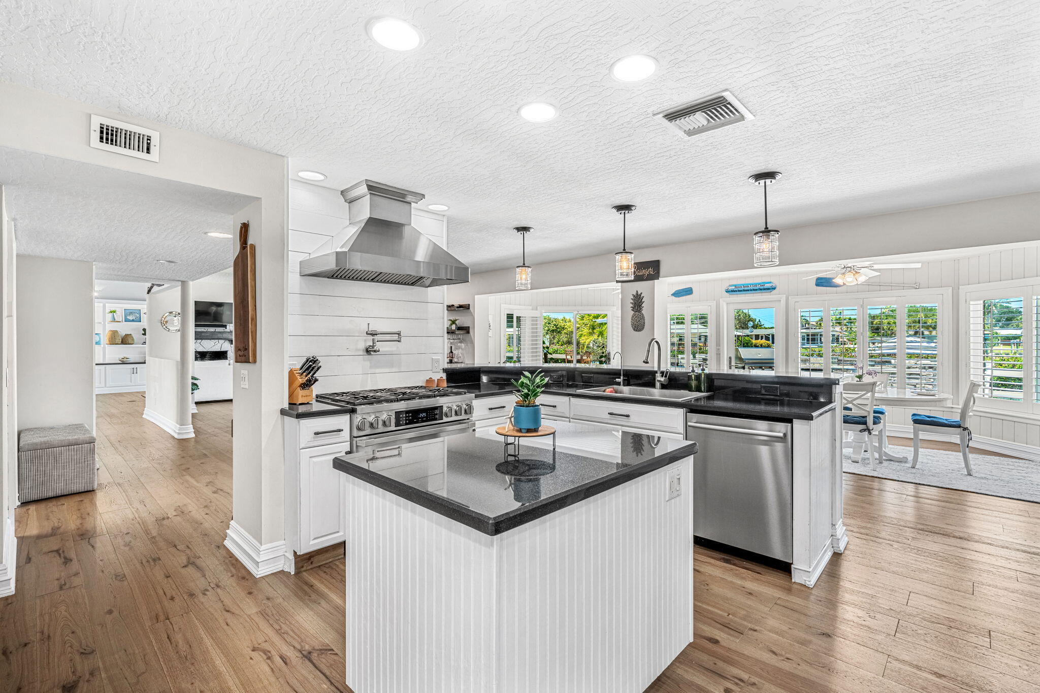 452 Sandy Key Melbourne Beach, FL 32951 - Photo 45 of 140 a kitchen with stainless steel appliances granite countertop a stove and a sink