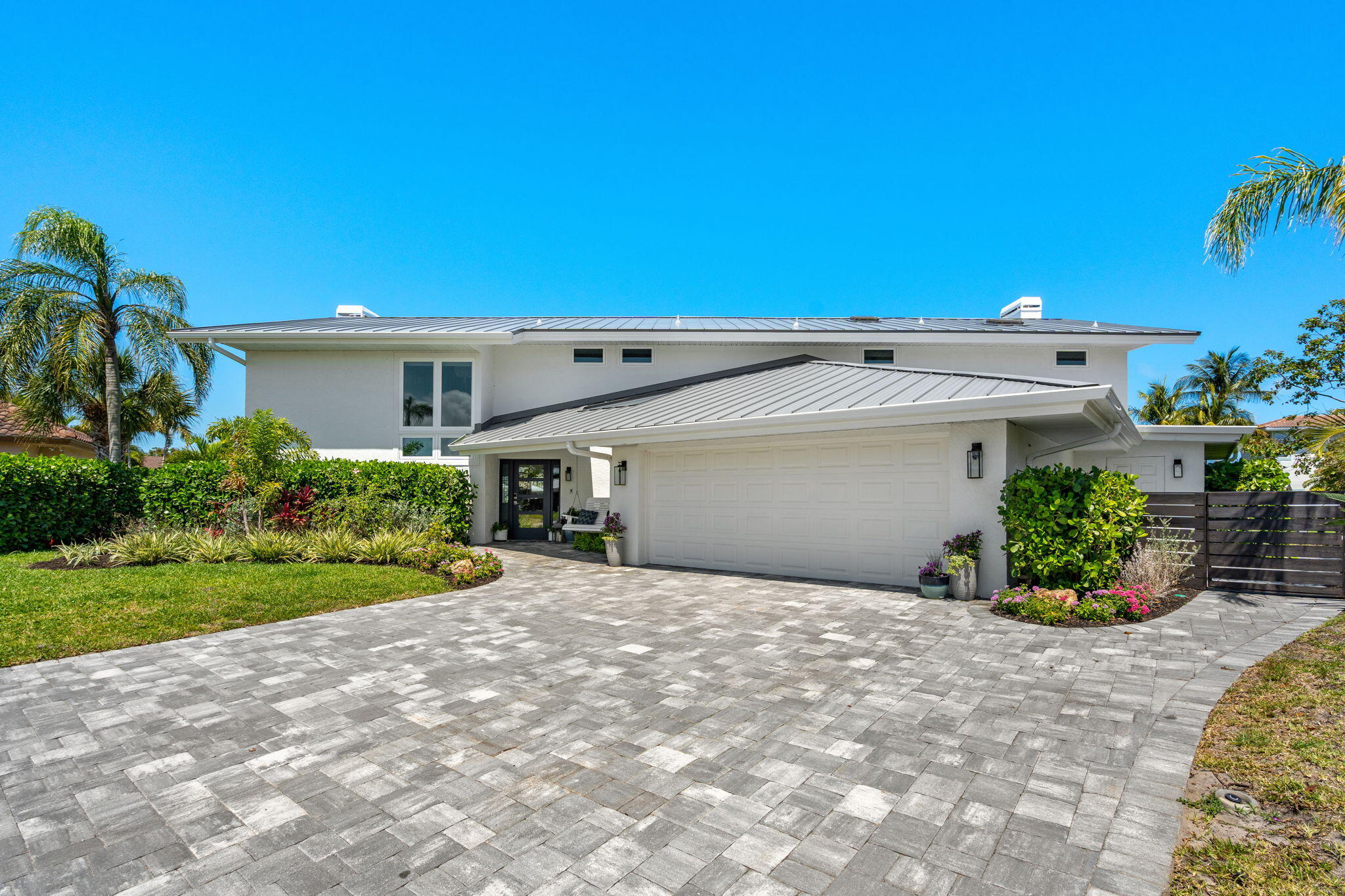 452 Sandy Key Melbourne Beach, FL 32951 - Photo 5 of 140 a view of a house with a yard and potted plants