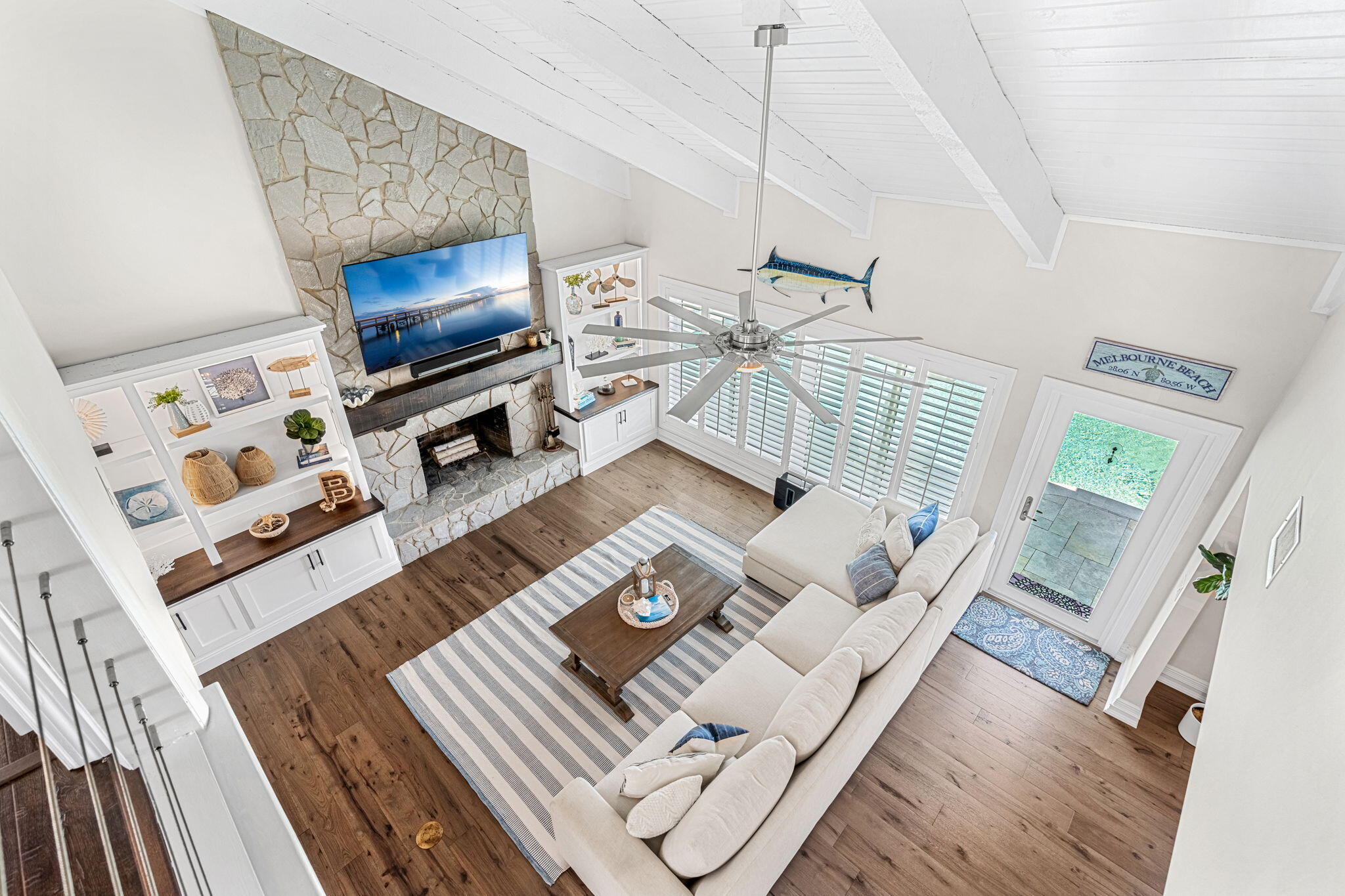 452 Sandy Key Melbourne Beach, FL 32951 - Photo 54 of 140 a living room with furniture and a flat screen tv