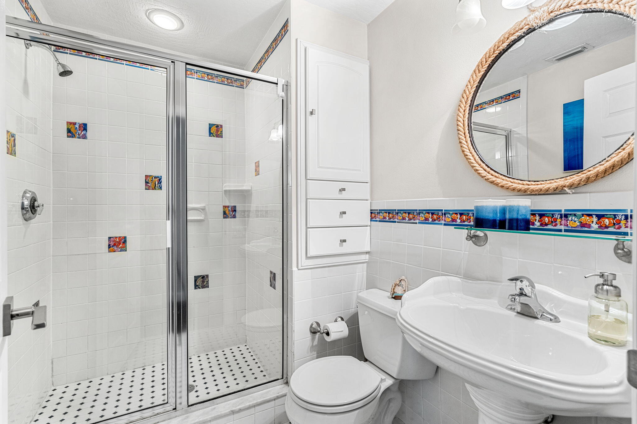 452 Sandy Key Melbourne Beach, FL 32951 - Photo 62 of 140 a bathroom with a sink a mirror a toilet and a shower