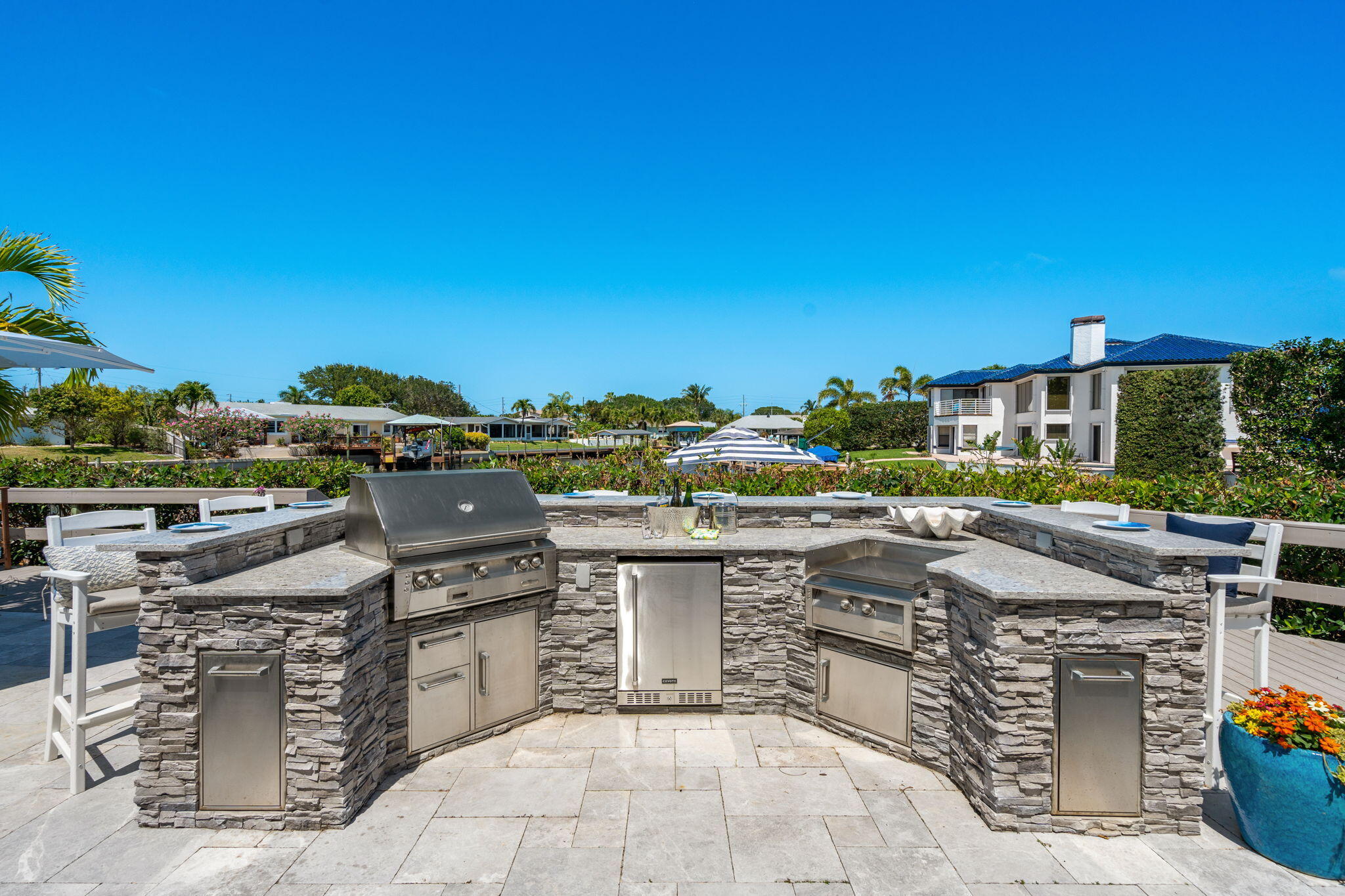 452 Sandy Key Melbourne Beach, FL 32951 - Photo 97 of 140 a view of a patio with swimming pool and outdoor seating