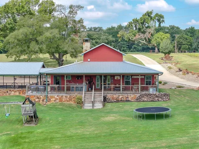 a view of a lake with a yard