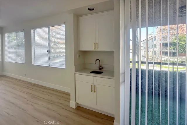 a kitchen with windows and sink