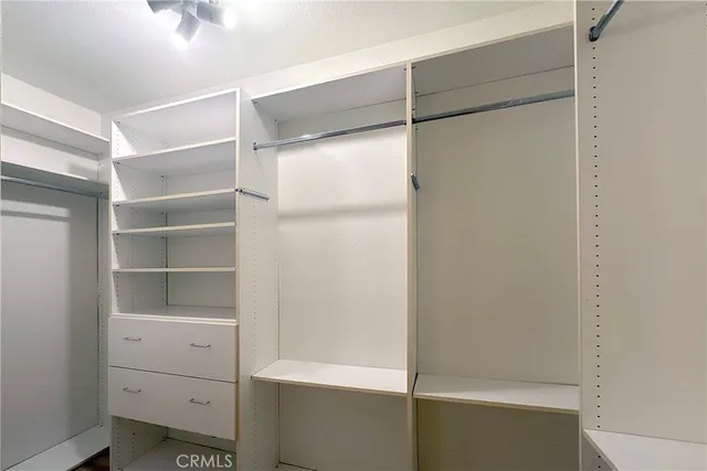 a view of an empty walk in closet