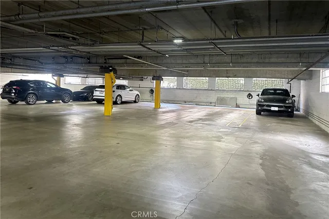 a view of a balcony with two chairs and a table