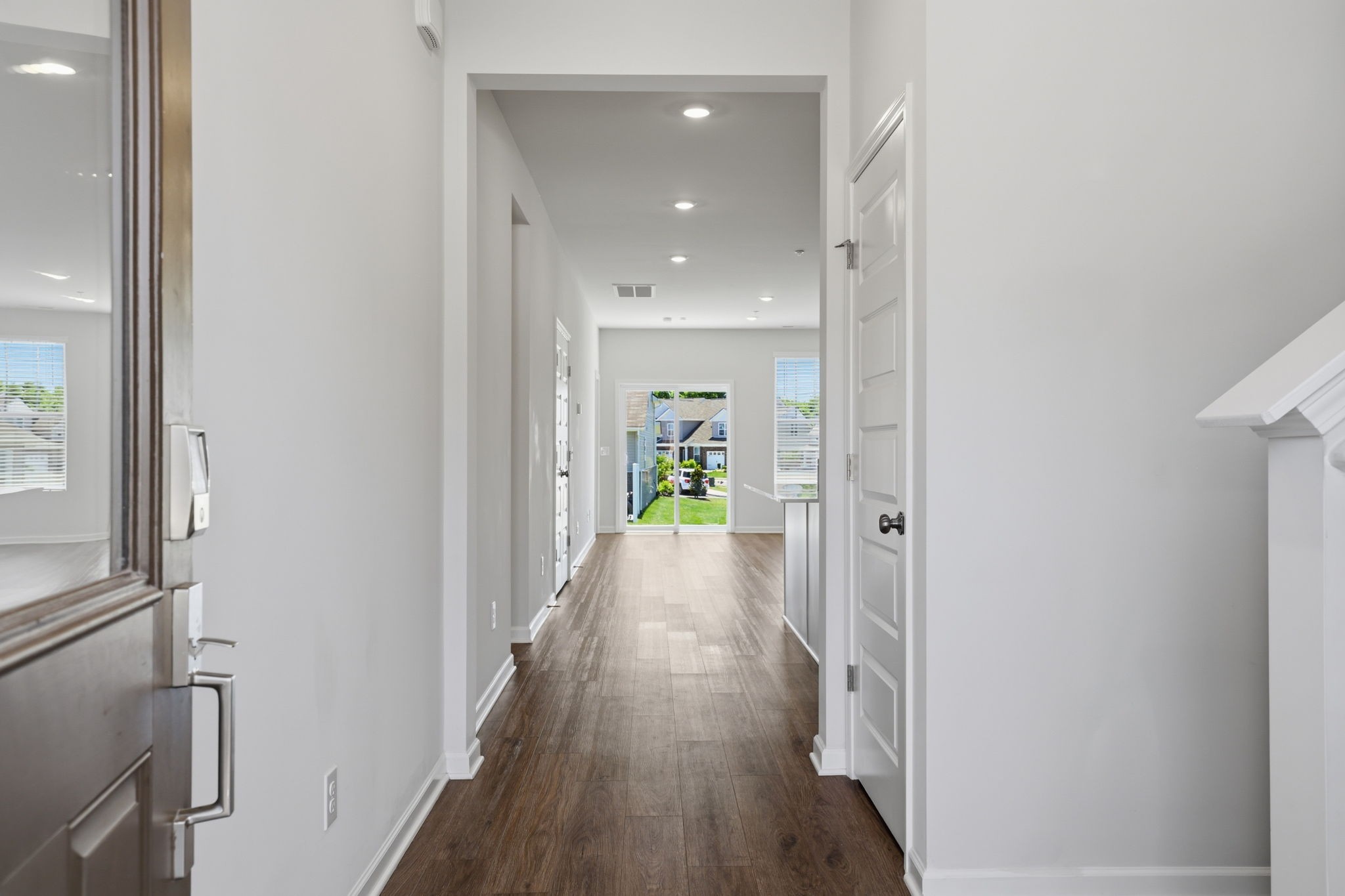 473 Alcott Way Spring Hill Spring Hill, TN 37174 - Photo 4 of 24 a view of a hallway with wooden floor and staircase