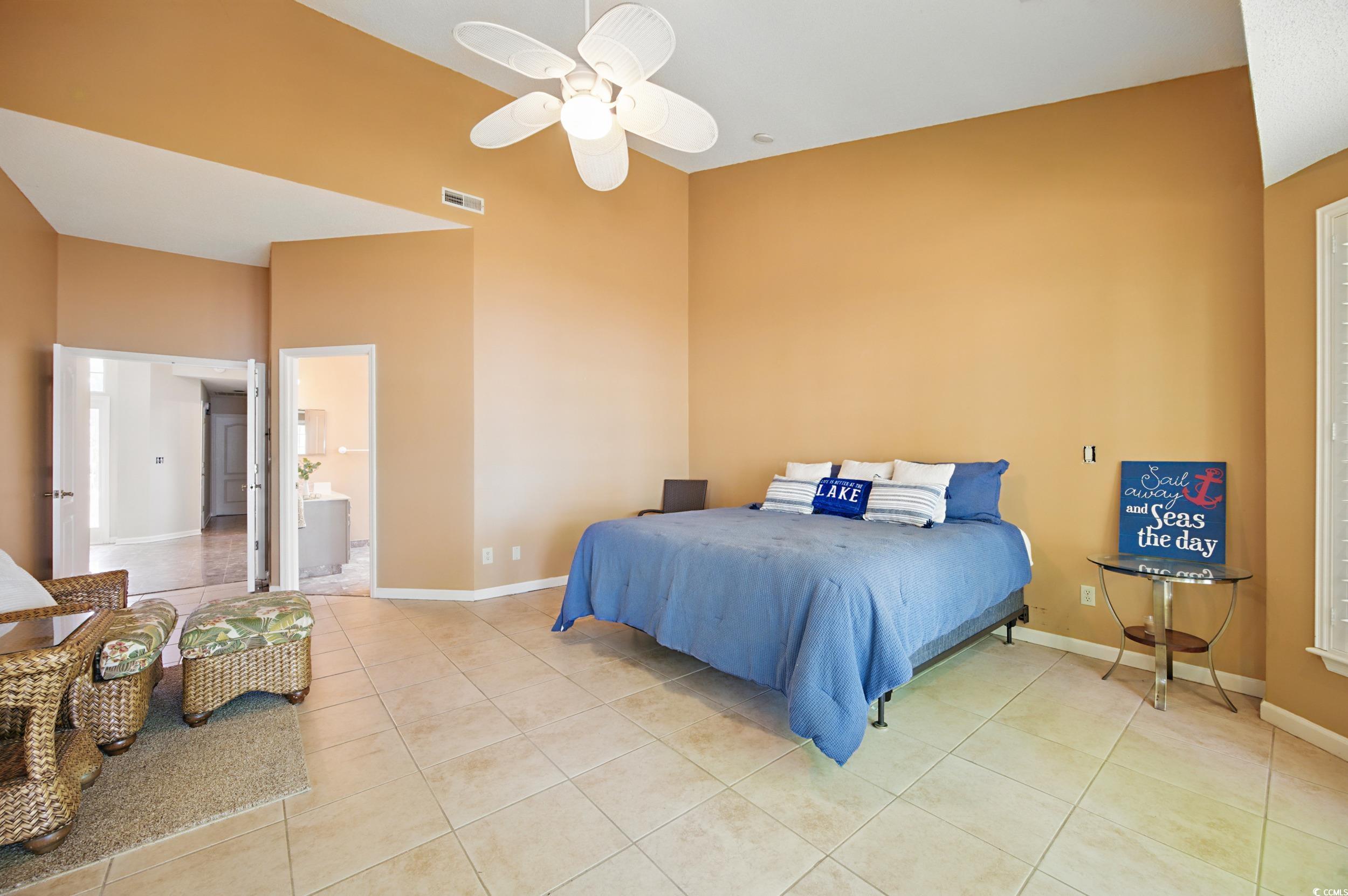 1673 Coventry Road Surfside Beach, SC 29575 - Photo 18 of 30 Bedroom with light tile patterned flooring, visibl