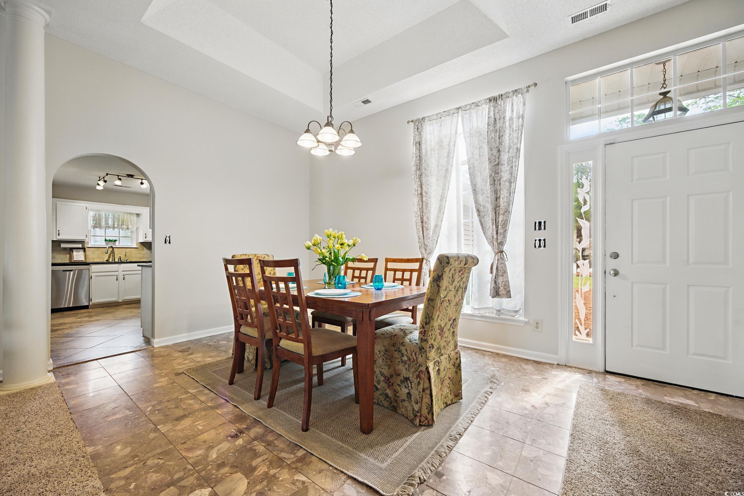 1673 Coventry Road Surfside Beach, SC 29575 - Photo 3 of 30 Tiled dining room with a sink, baseboards, a tray