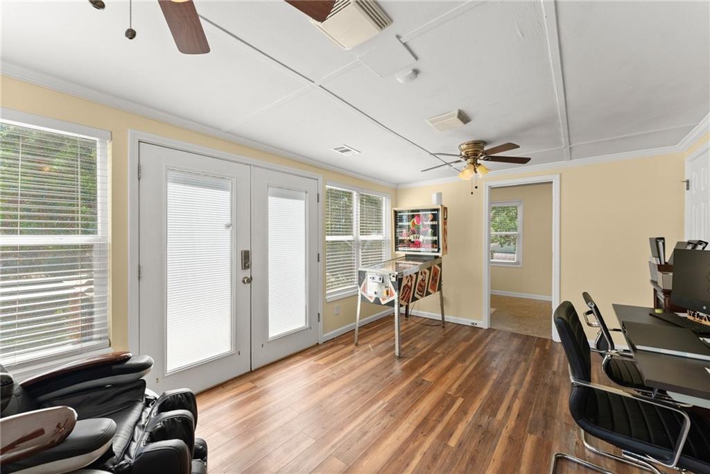 6455 Main Street Lula, GA 30554 - Photo 13 of 43 a work room with furniture and wooden floor