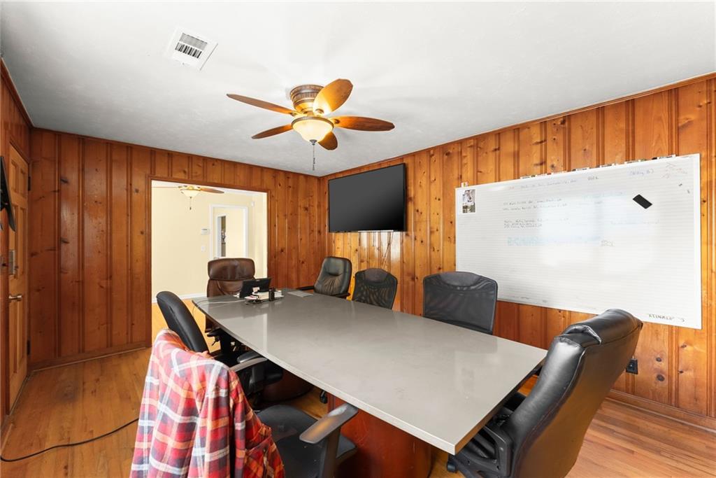 6455 Main Street Lula, GA 30554 - Photo 18 of 43 a view of a dining room with furniture and wooden floor