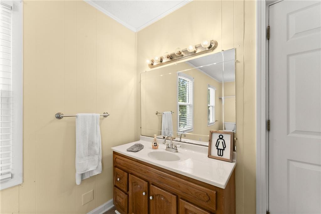 6455 Main Street Lula, GA 30554 - Photo 27 of 43 a bathroom with a sink and a mirror