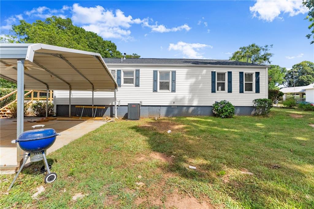 6455 Main Street Lula, GA 30554 - Photo 32 of 43 a swimming pool with outdoor seating and yard
