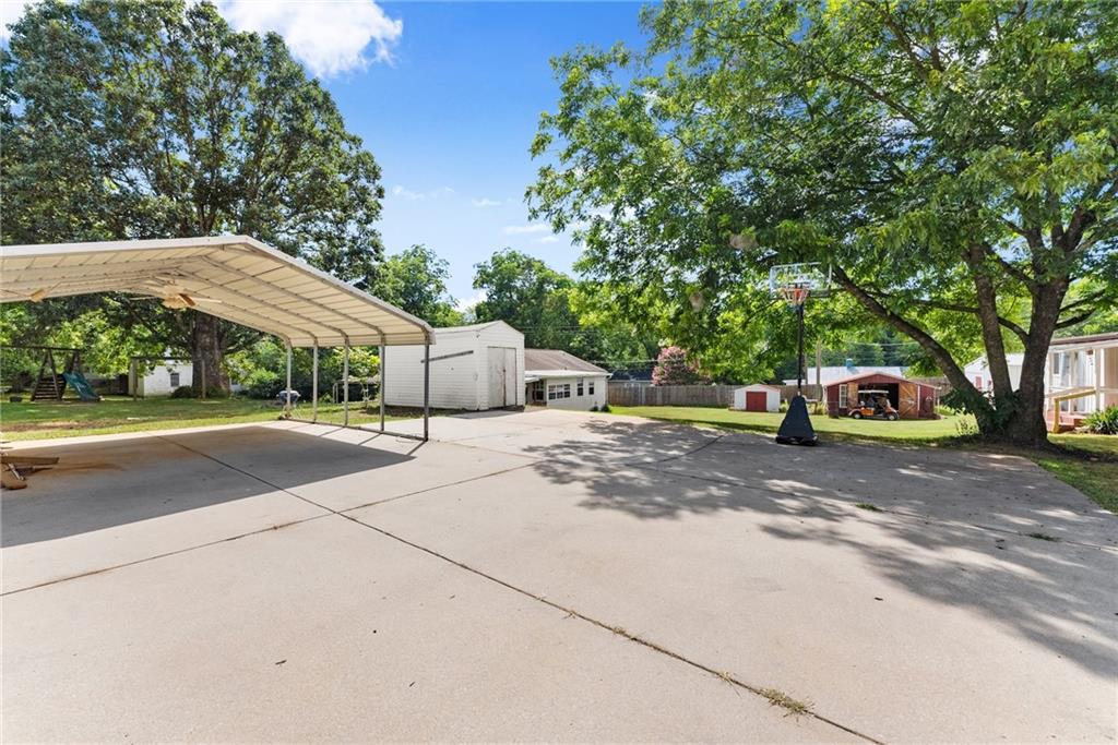 6455 Main Street Lula, GA 30554 - Photo 34 of 43 a car parked on the side of the road