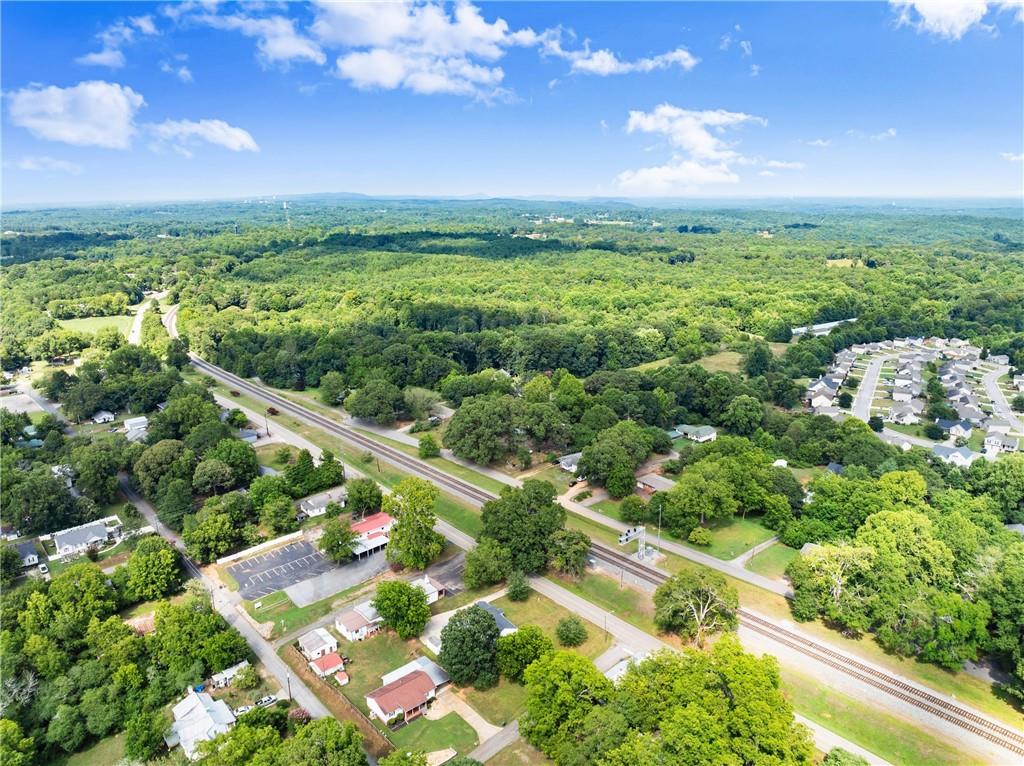 6455 Main Street Lula, GA 30554 - Photo 41 of 43 a view of a city with lush green forest