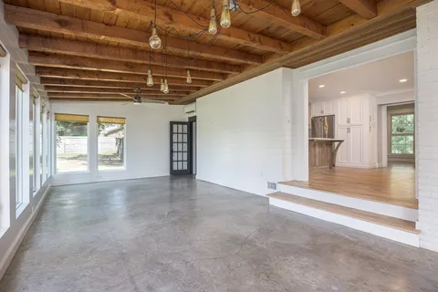 a front view of a house with a yard table and chairs