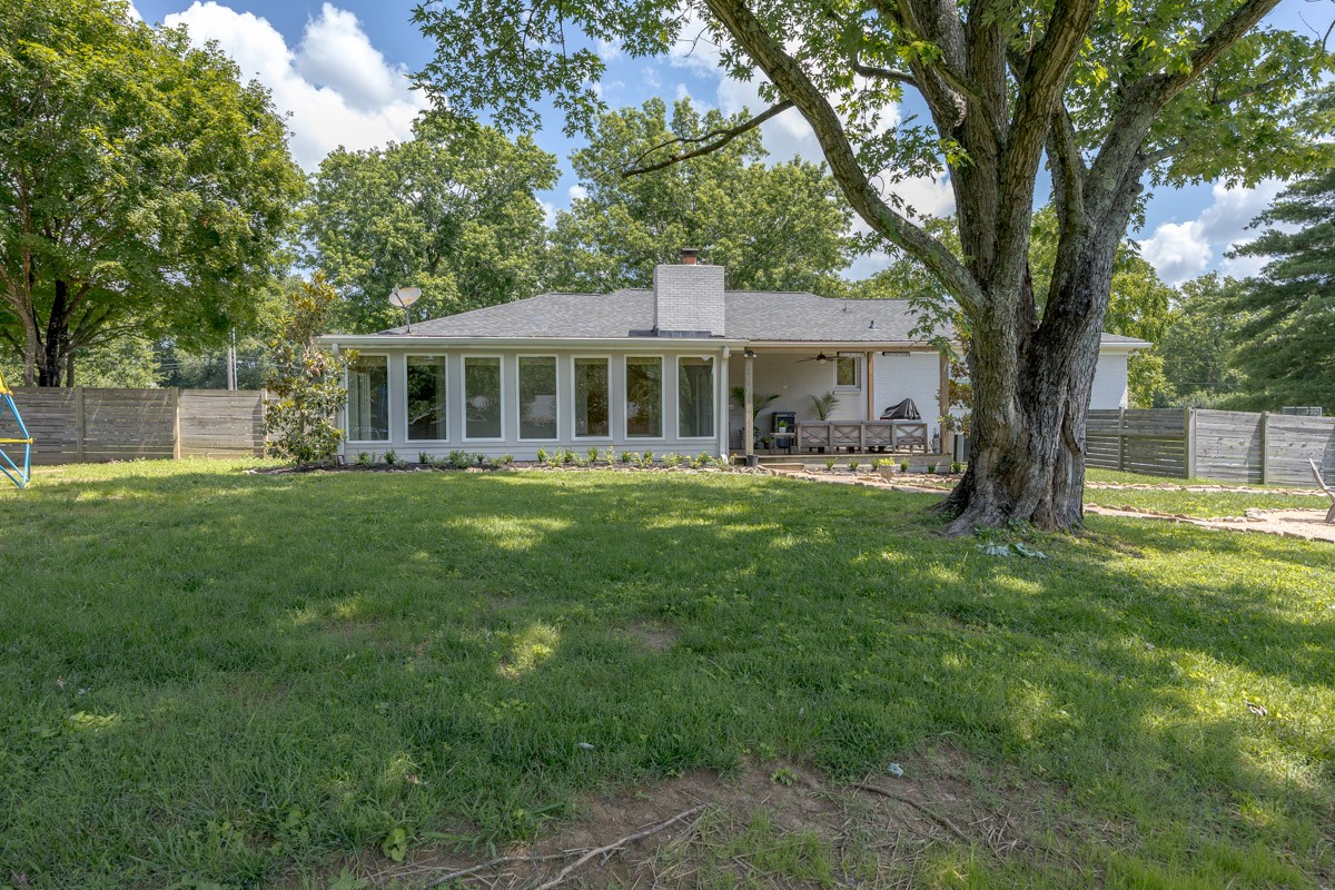 109 Poplar Street Franklin, TN 37064 - Photo 48 of 72 a front view of a house with a yard table and chairs