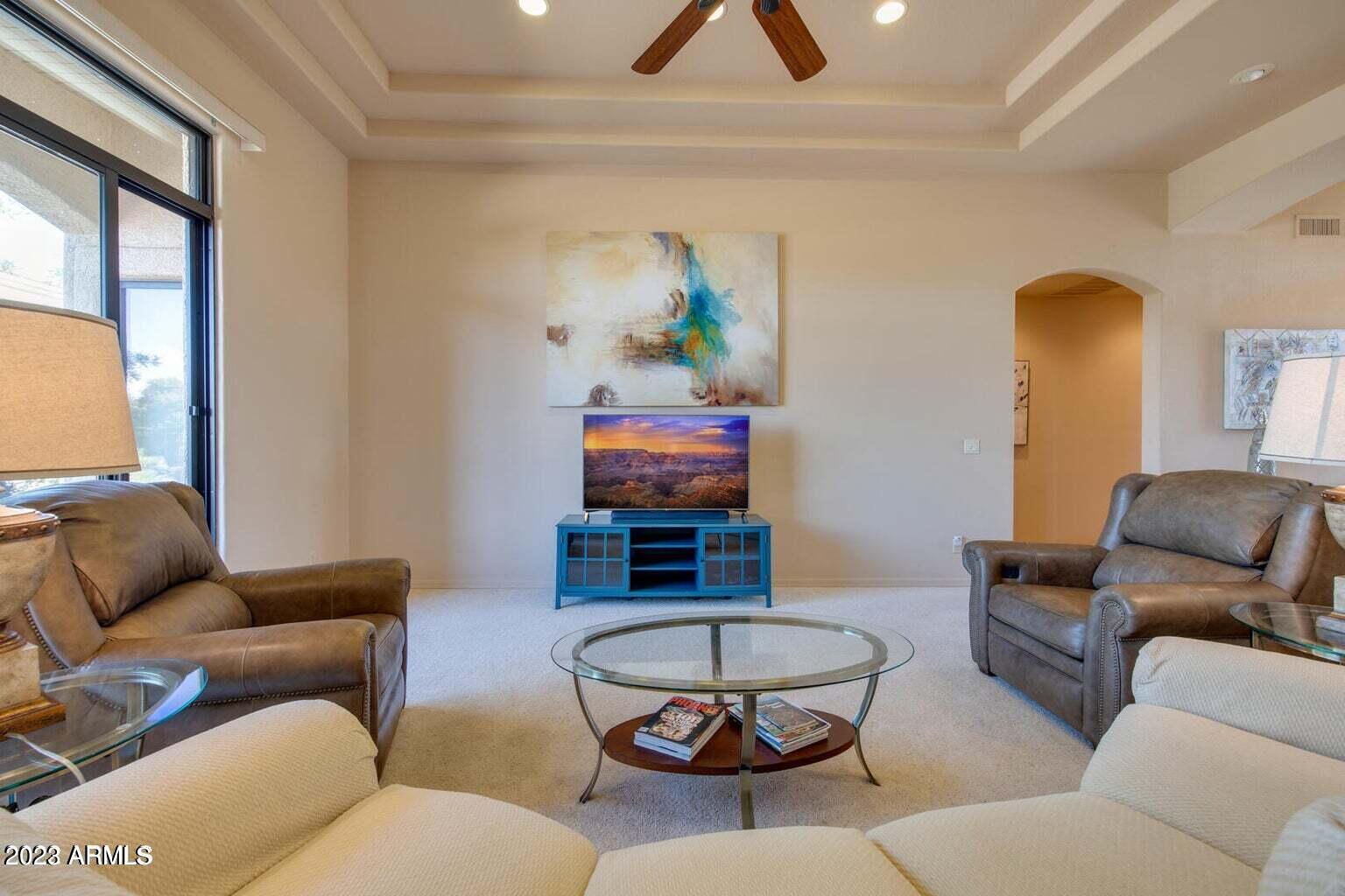 25603 North Sago Drive Rio Verde, AZ 85263 - Photo 5 of 25 a living room with furniture a rug and a window