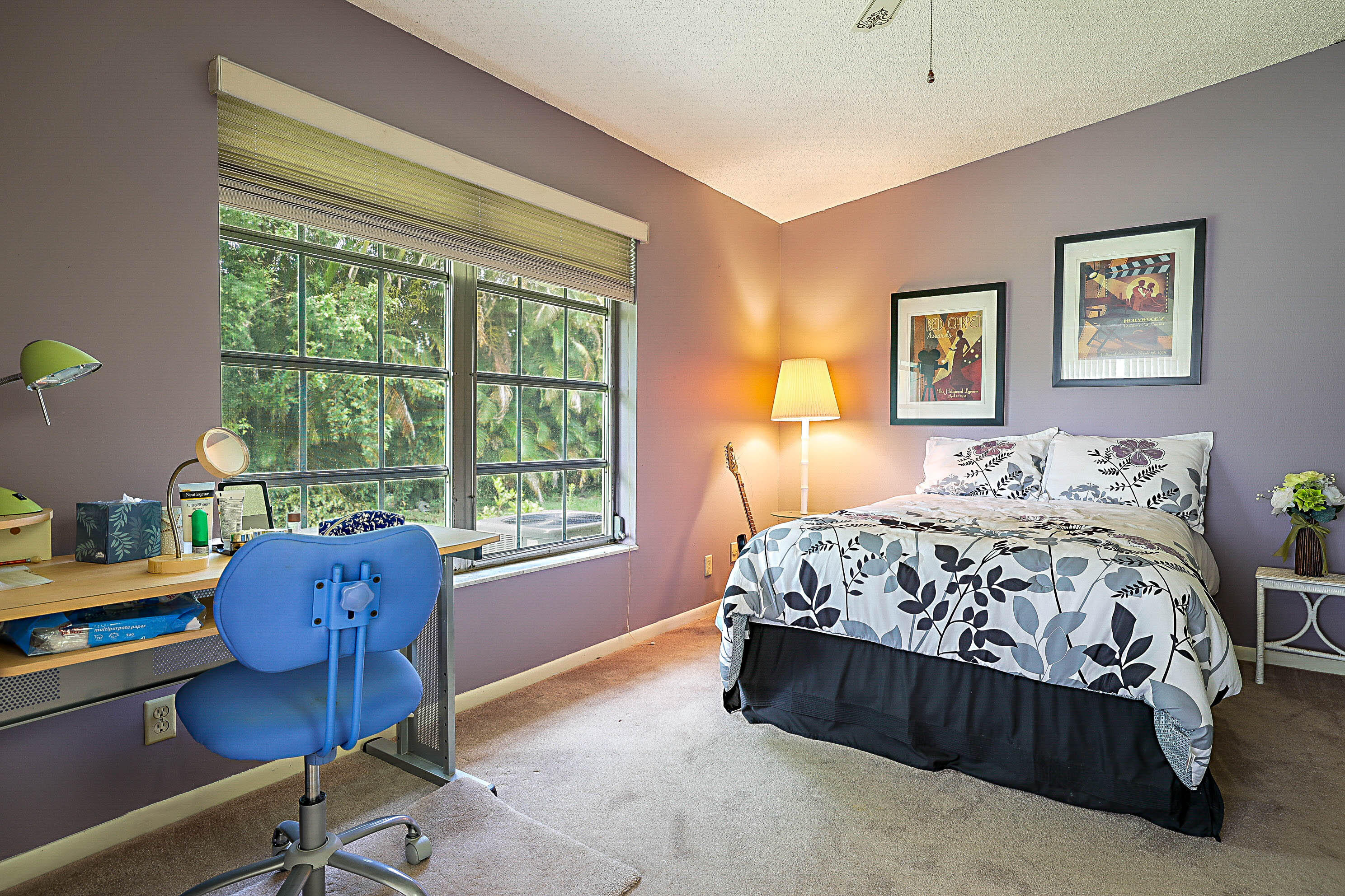 5231 Copperleaf Circle Delray Beach, FL 33484 - Photo 20 of 31 a bed sitting in a bedroom next to a window