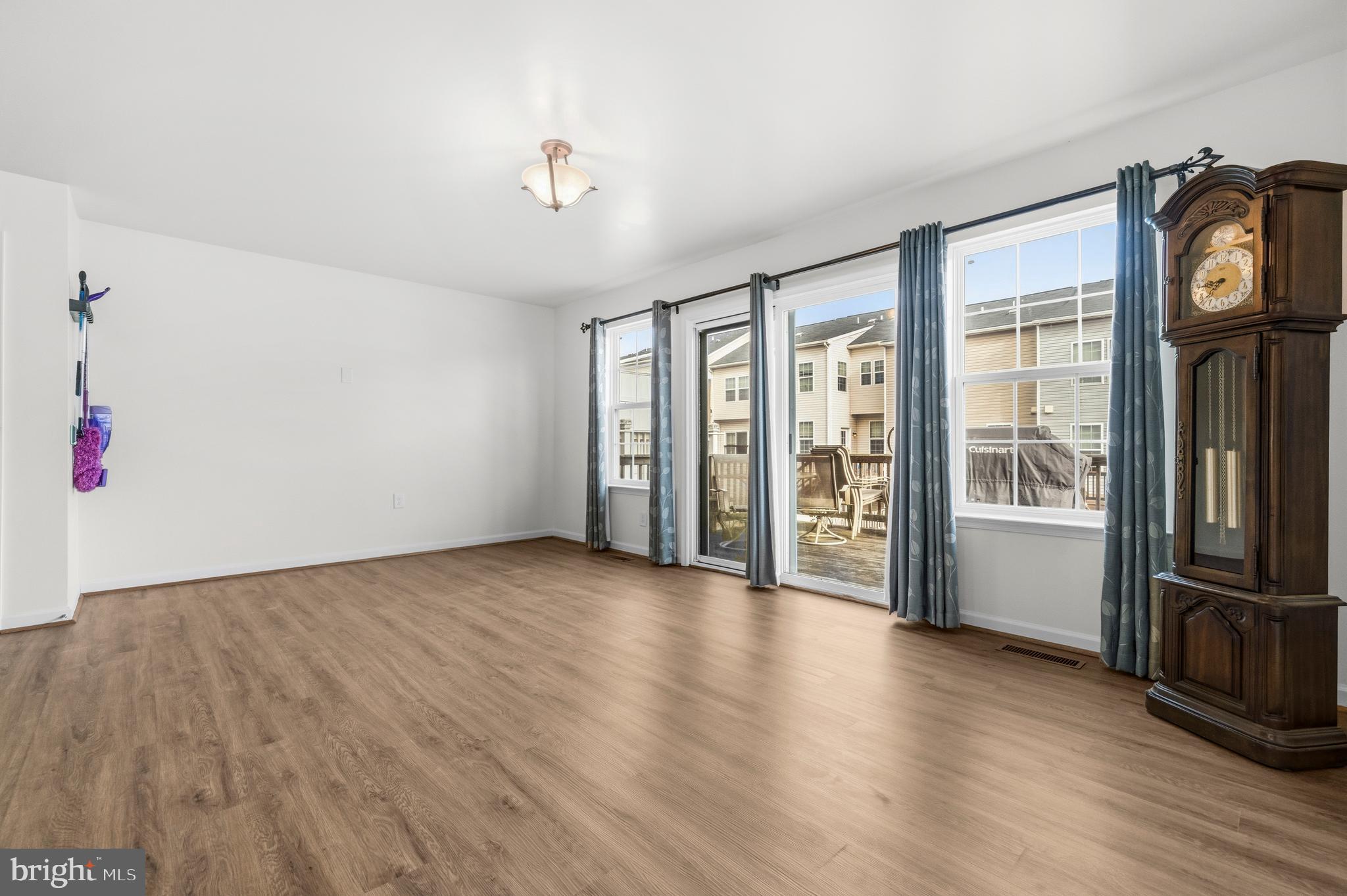 31 Wayside Court Falling Waters, WV 25419 - Photo 14 of 36 a view of an empty room with a window and wooden floor