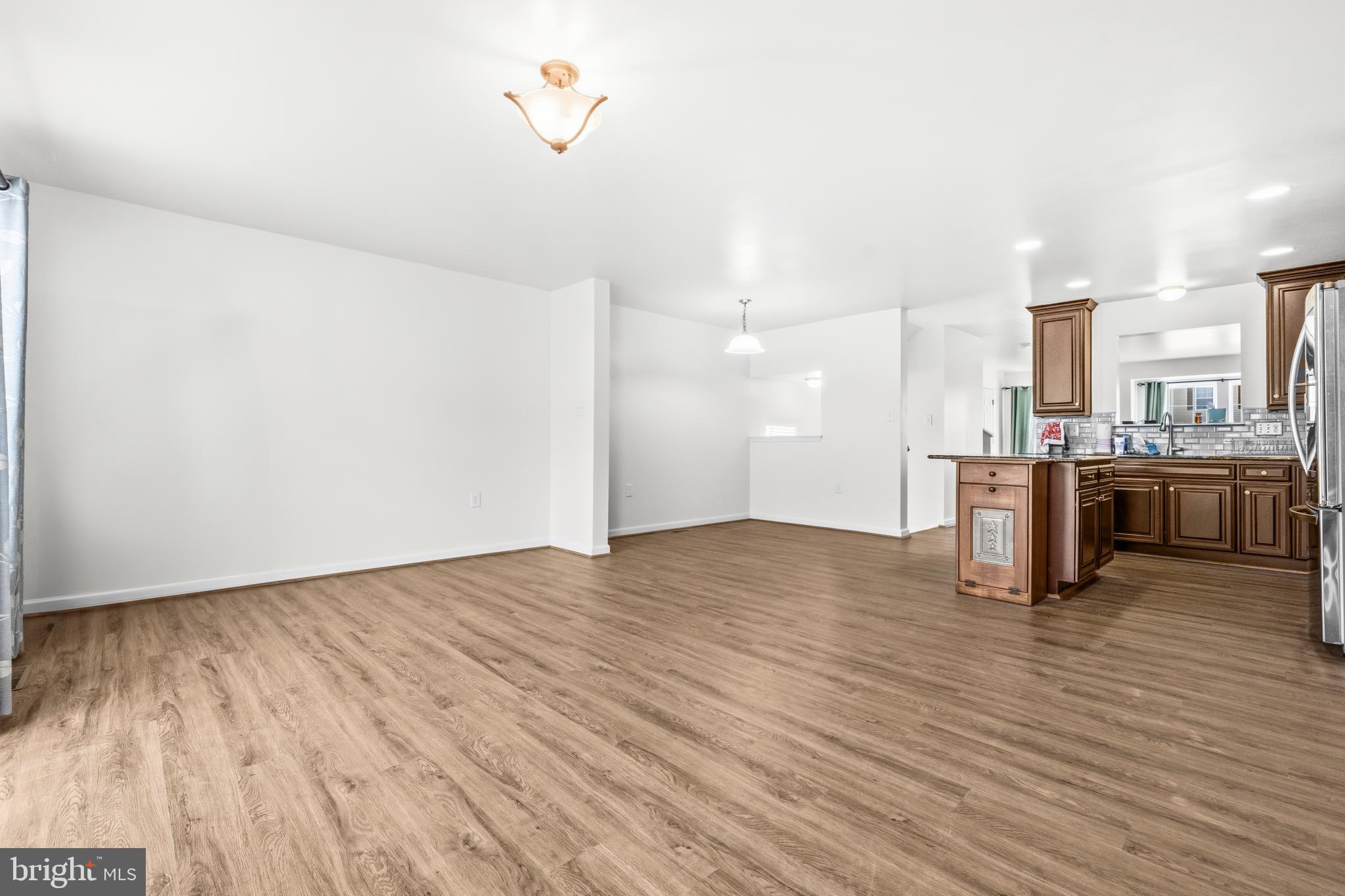 31 Wayside Court Falling Waters, WV 25419 - Photo 15 of 36 a view of kitchen with furniture and wooden floor