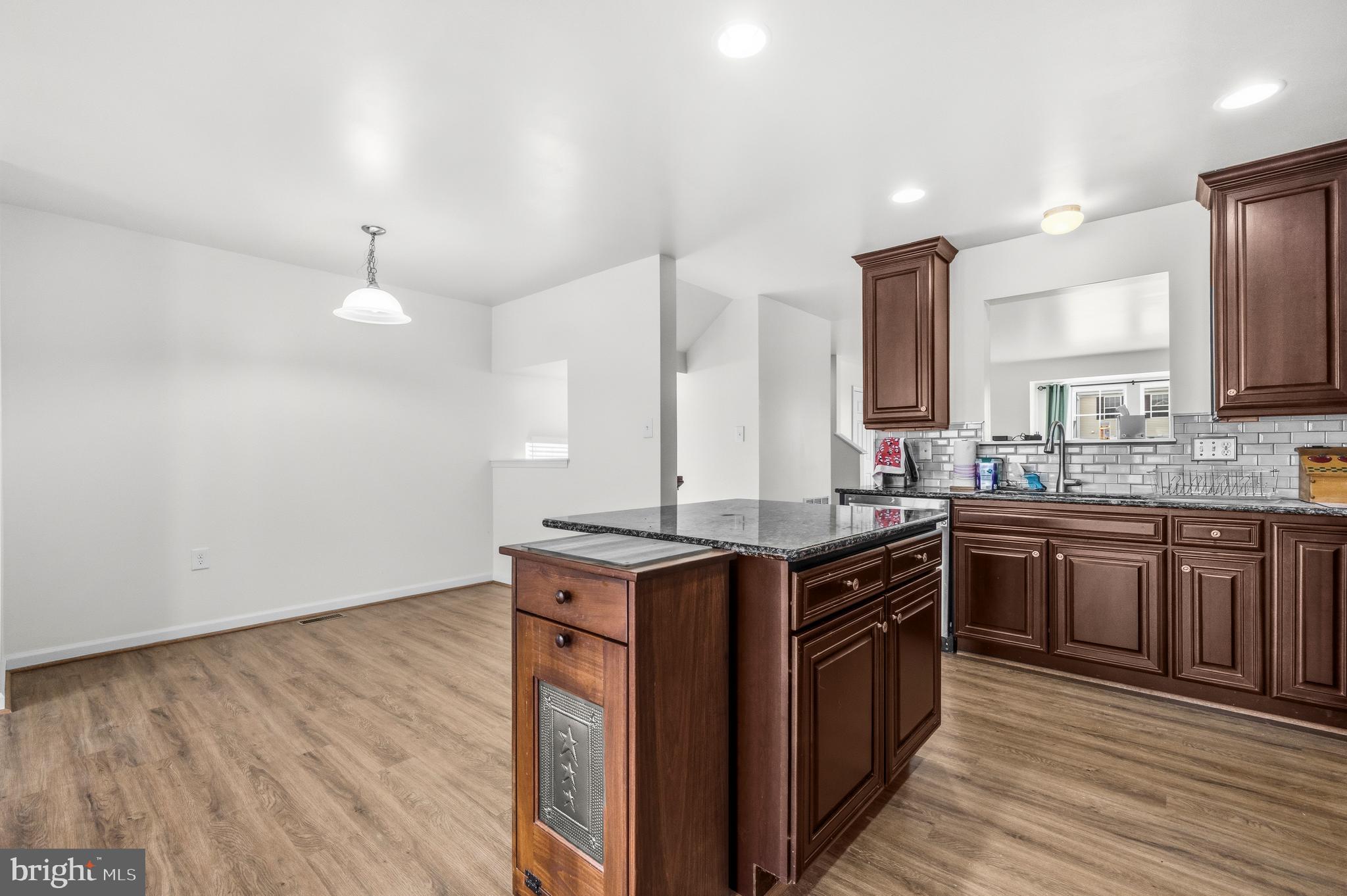 31 Wayside Court Falling Waters, WV 25419 - Photo 9 of 36 a kitchen with stainless steel appliances granite countertop a stove and a sink