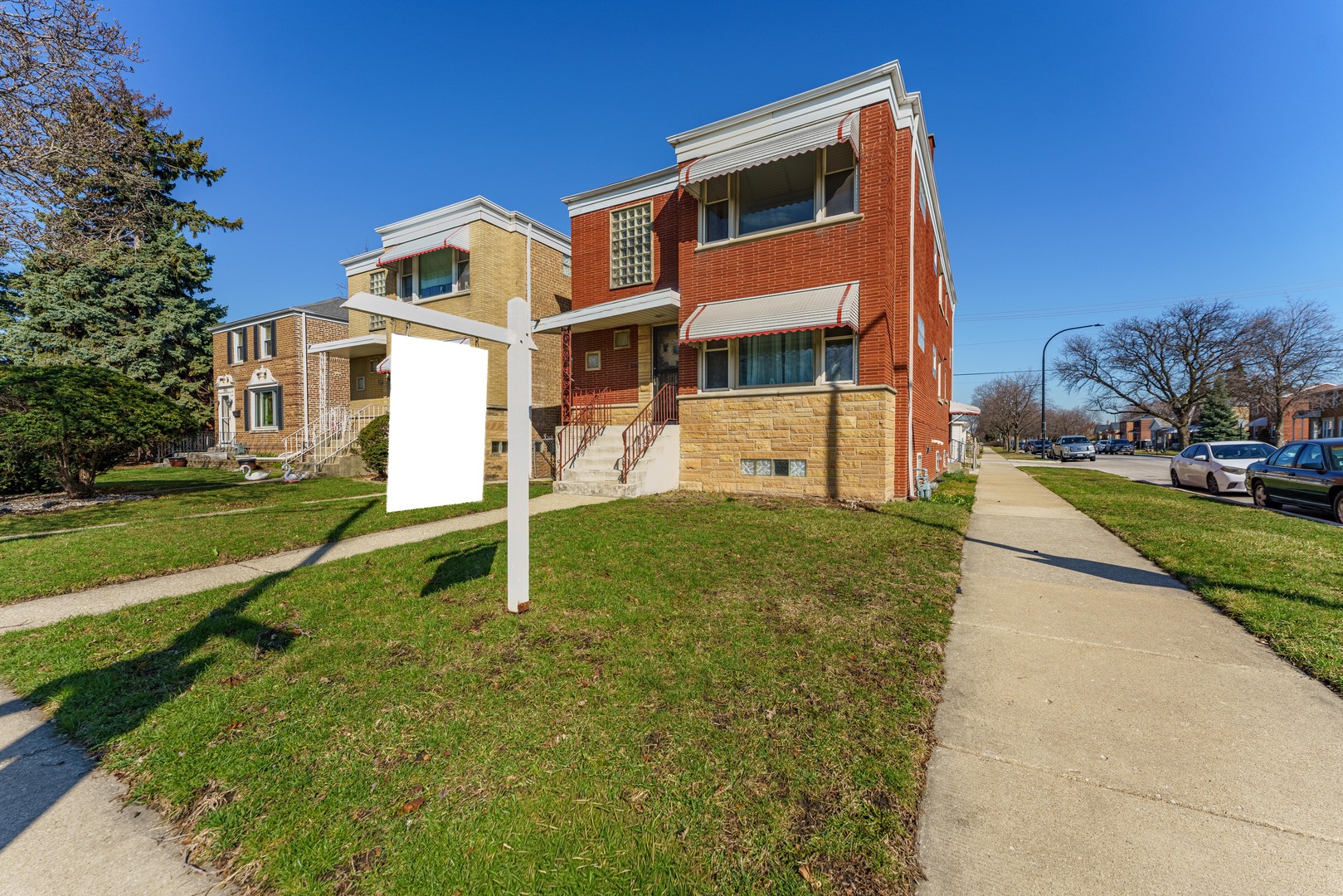 a front view of a house with a yard