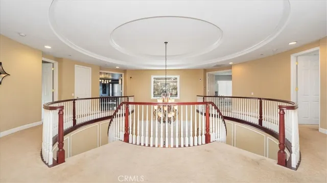 a room with a table chairs and wooden floor