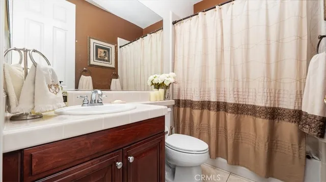 an aerial view of residential house with outdoor space and parking