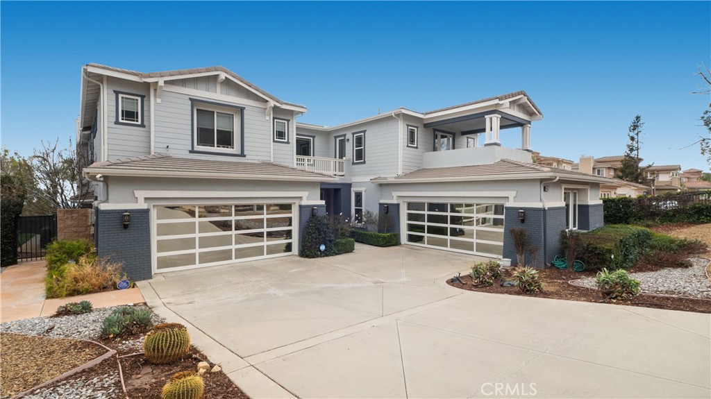 9655 Norbrook Drive Rancho Cucamonga, CA 91737 - Photo 5 of 68 a front view of a house with a yard and garage