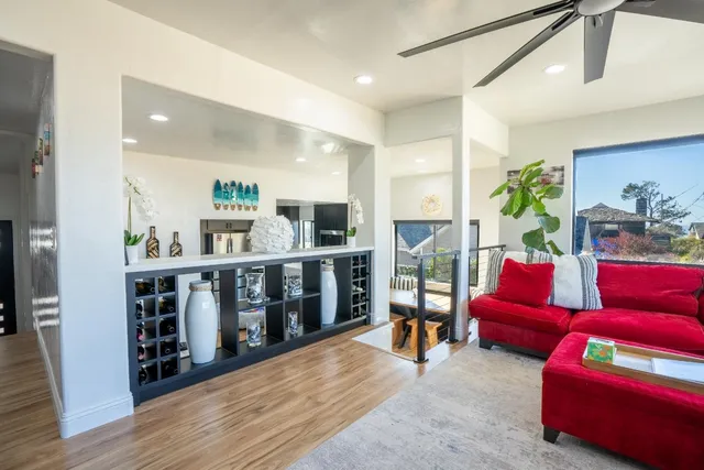 a view of a hallway with wooden floor and closet