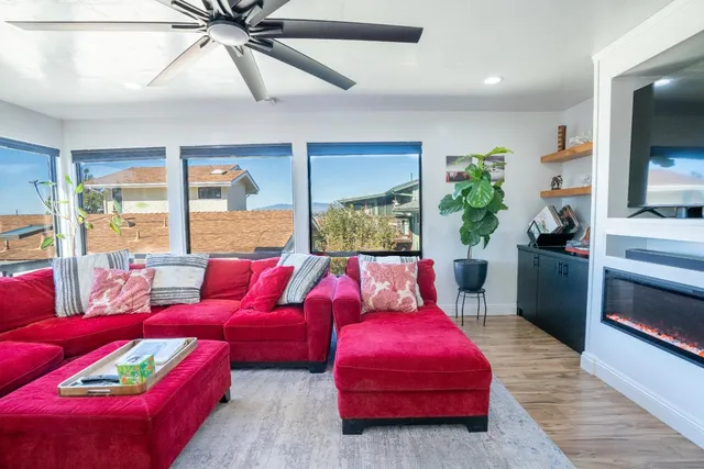 a living room with furniture and a fireplace