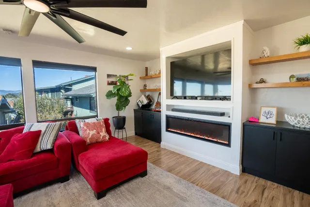 a view of a dining room with furniture window and wooden floor