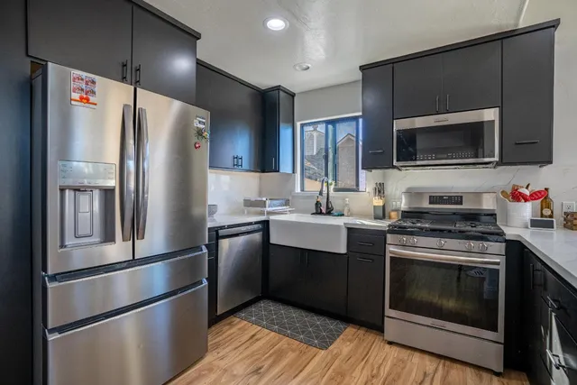 a bathroom with a sink mirror toilet and shower