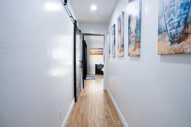 a bed room with a bed and a television