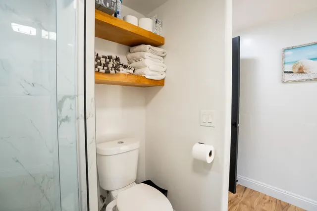 a view of a patio with table and chairs