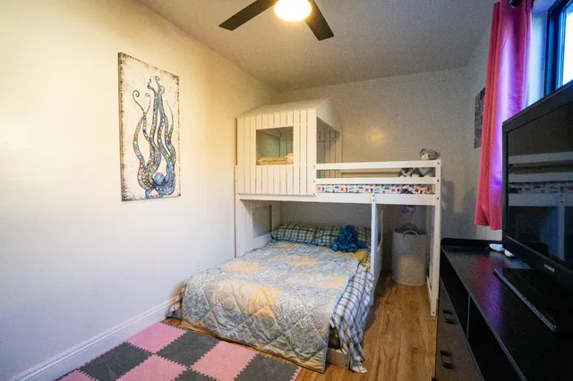 a view of a house with backyard and porch