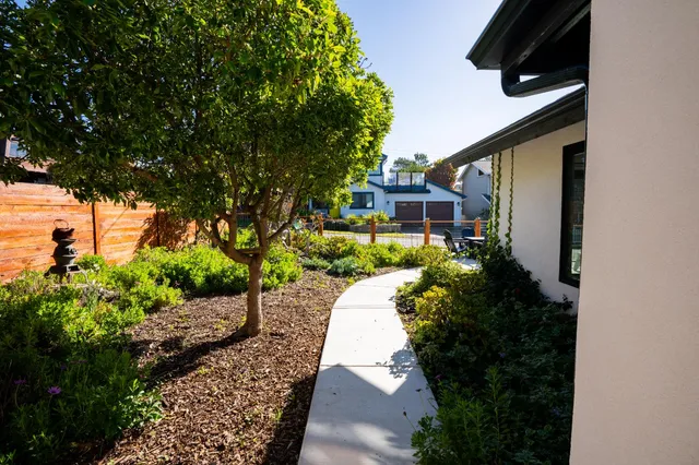 an aerial view of houses with outdoor space