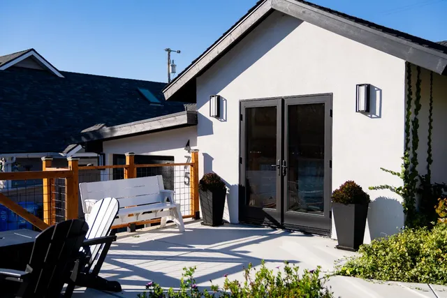 a view of a patio with table and chairs and potted plants