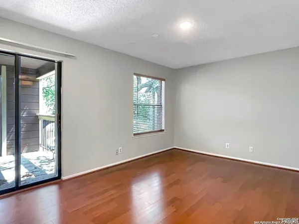 an empty room with wooden floor