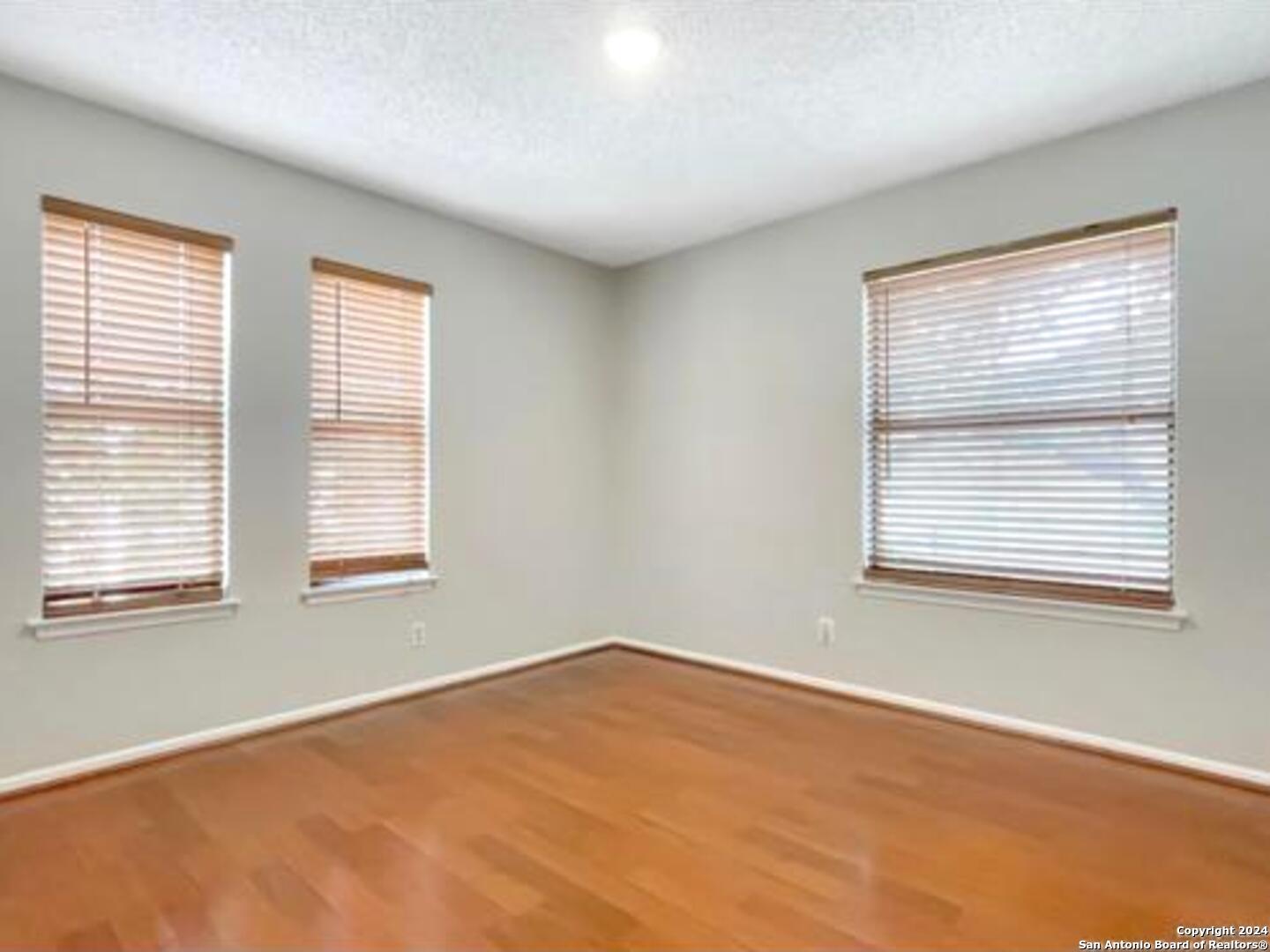 11520 Huebner Road, Unit 107 San Antonio, TX 78230 - Photo 17 of 22 a view of an empty room with a window