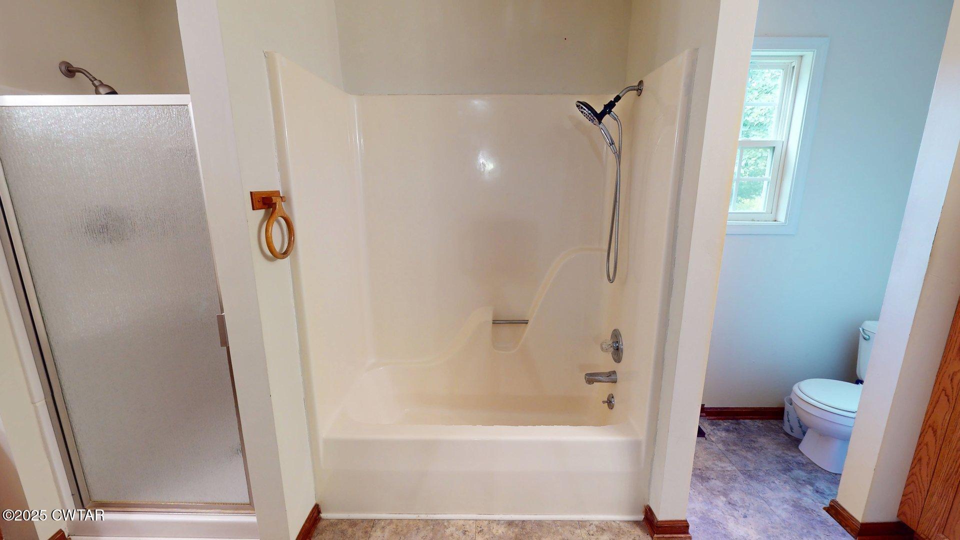 1921 Forrester Road Newbern, TN 38059 - Photo 13 of 18 a bathroom with a shower and a toilet