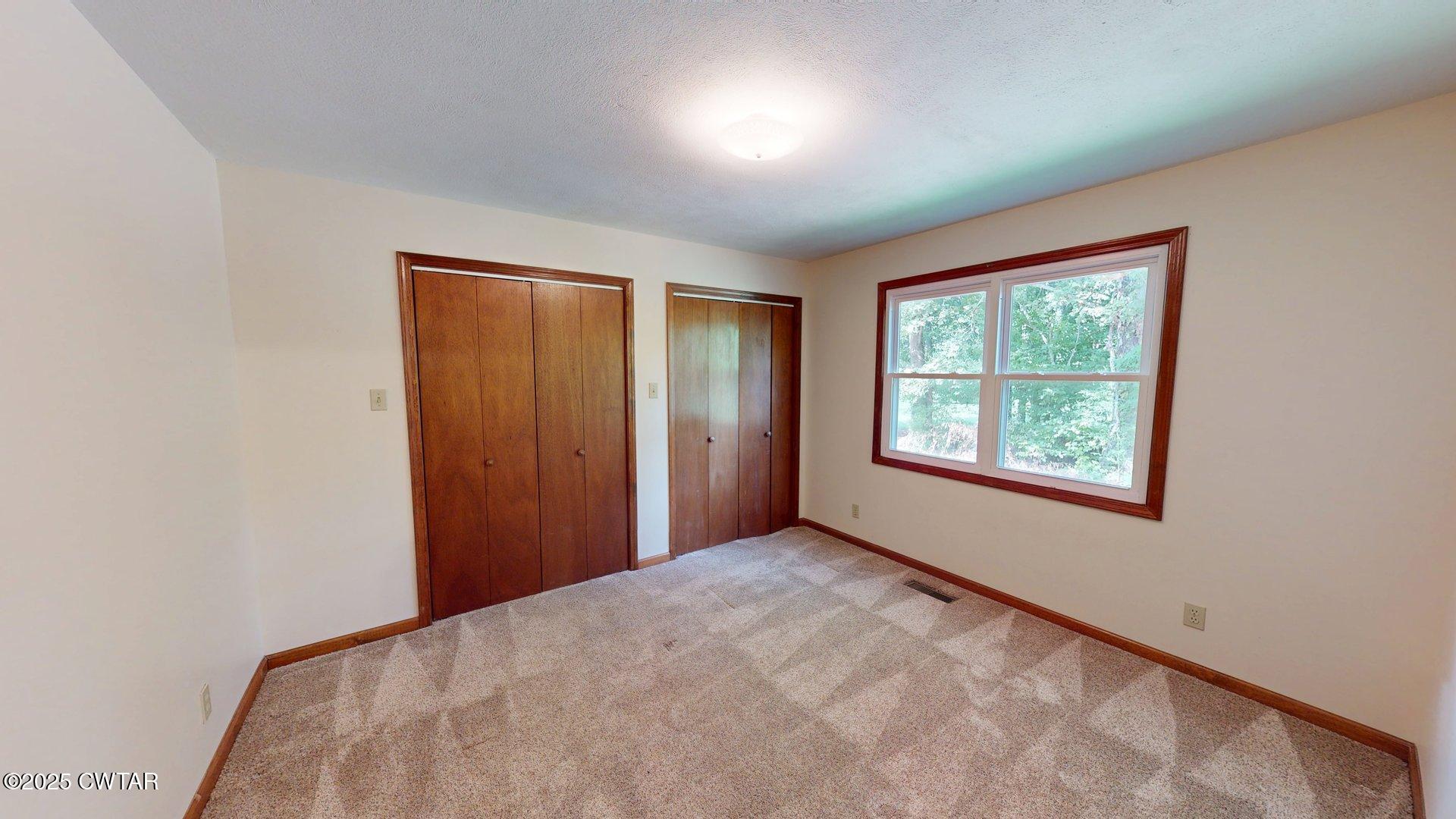 1921 Forrester Road Newbern, TN 38059 - Photo 15 of 18 an empty room with windows