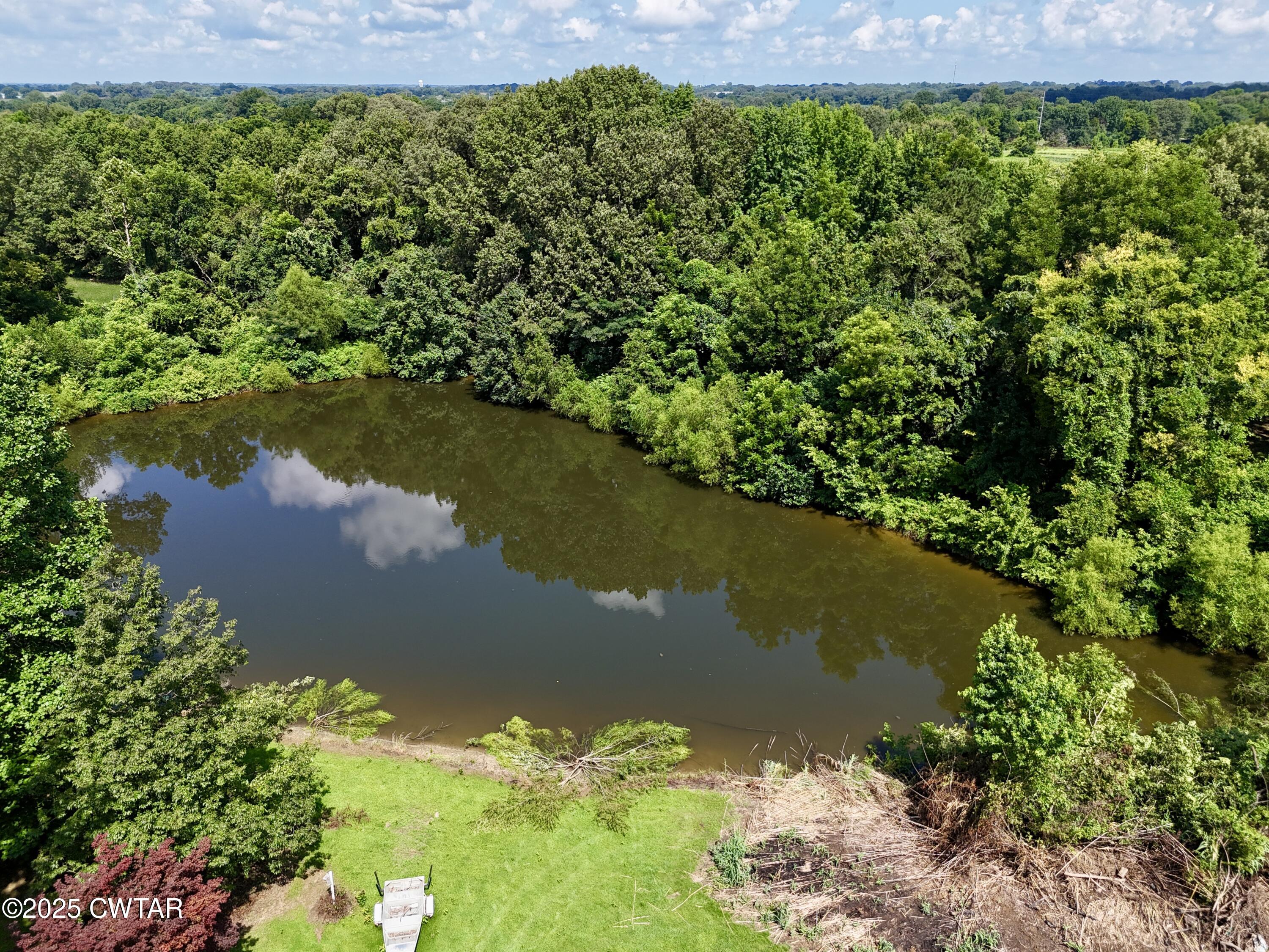 1921 Forrester Road Newbern, TN 38059 - Photo 17 of 18 a view of a lake with a yard