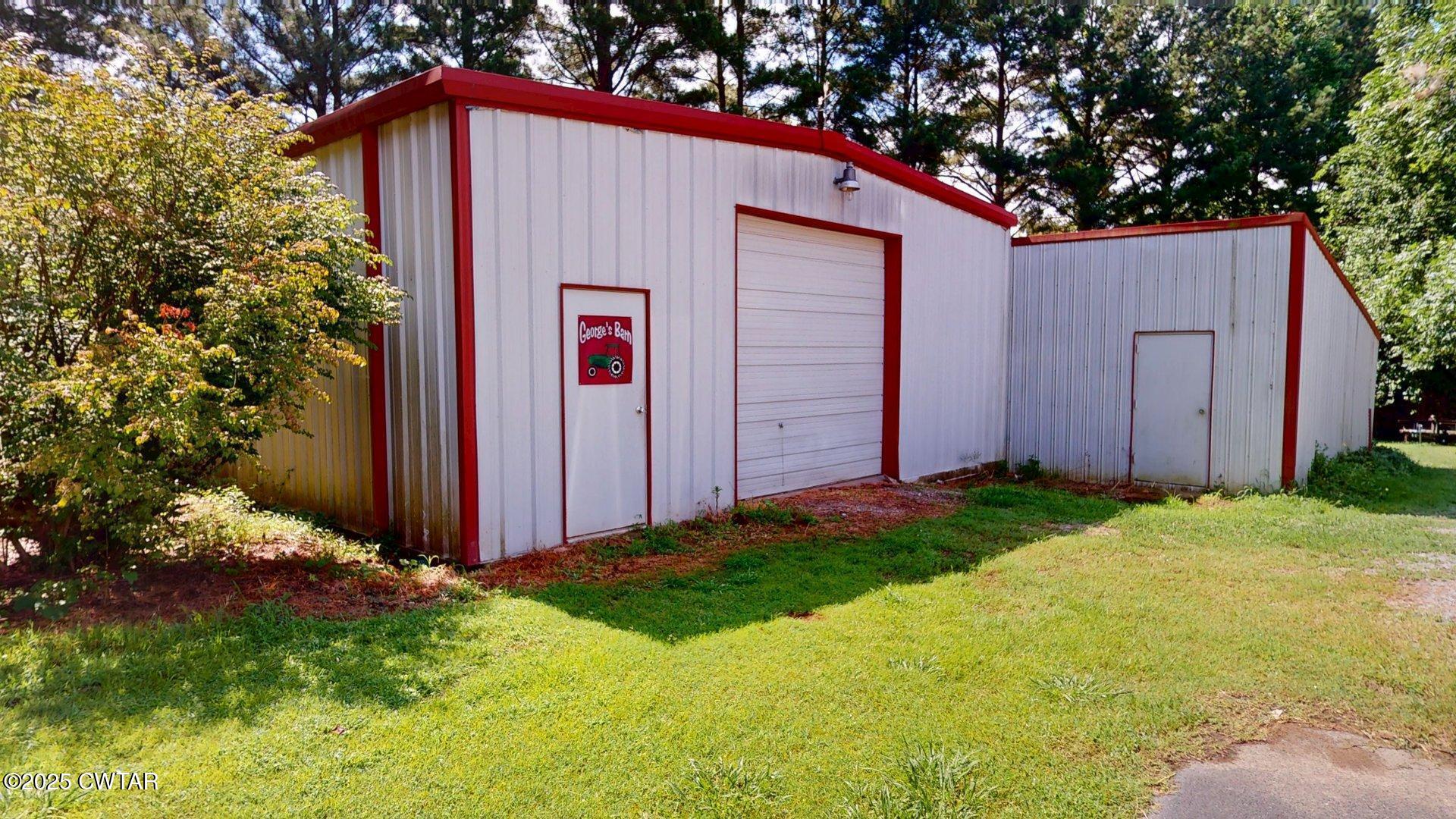 1921 Forrester Road Newbern, TN 38059 - Photo 3 of 18 a front view of house with yard and trees